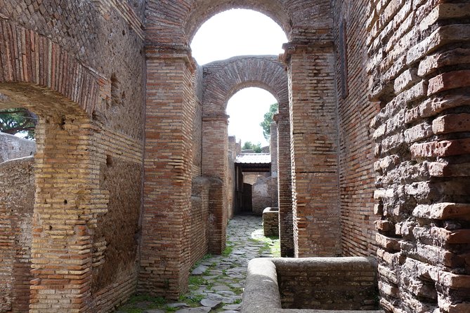 Ancient Ostia Antica Semi-Private Day Trip from Rome by Train with Guide - Forum of the Corporations, Temples, Taverns, and Public Baths