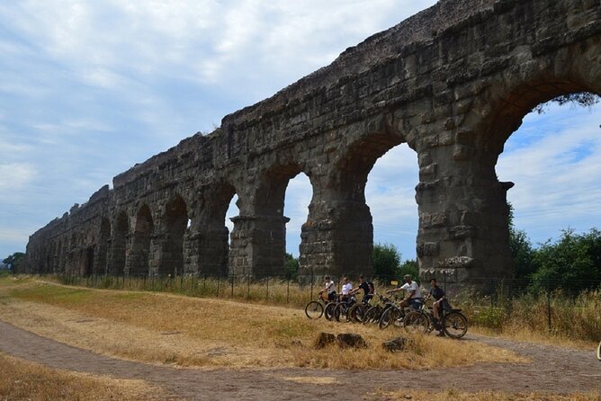 Appian Way Bike tour Underground with Catacombs & Lunch - Riding the Appian Way: quarry tunnels and WWII air shelters