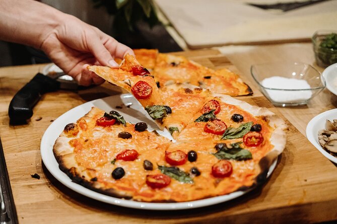 Devour Rome Wine & Pizza Making Class in Trastevere Neighborhood - Eating your pizza with unlimited wine or beer