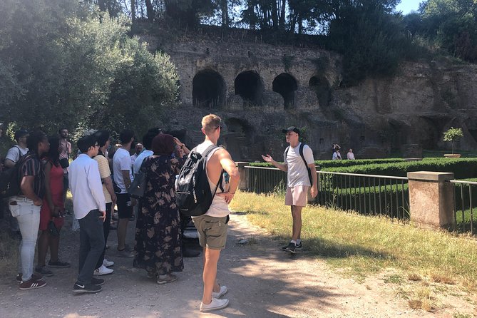 Guided Group Tour of Colosseum, Roman Forum and Palatine Hill - Colosseum: gladiators, naval combats, and the crowd you’re standing inside