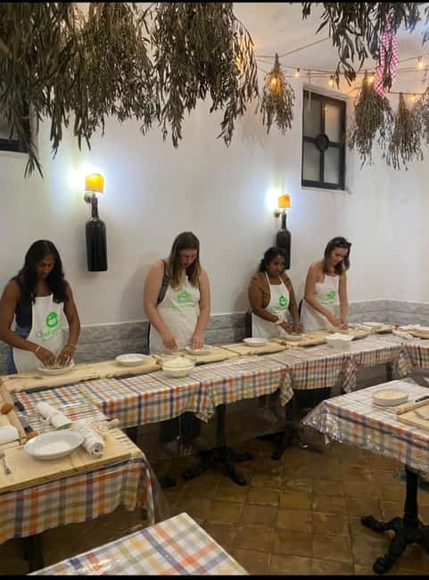 Pasta and tiramisù Cooking class with Wine at Piazza Navona - The wine, limoncello toast, and the moment you sit down