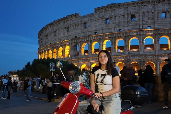 Roma Vespa Tour Pick-up from Hotel - Stop 1 at Via del Colosseo 31: exterior Colosseum views and Vespa photos