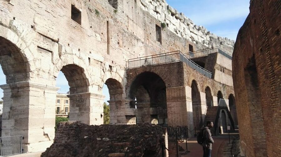 Rome: Colosseum Arena and Ancient Rome Guided Tour - Roman Forum Stops: Government Buildings, Marketplace, and Temples