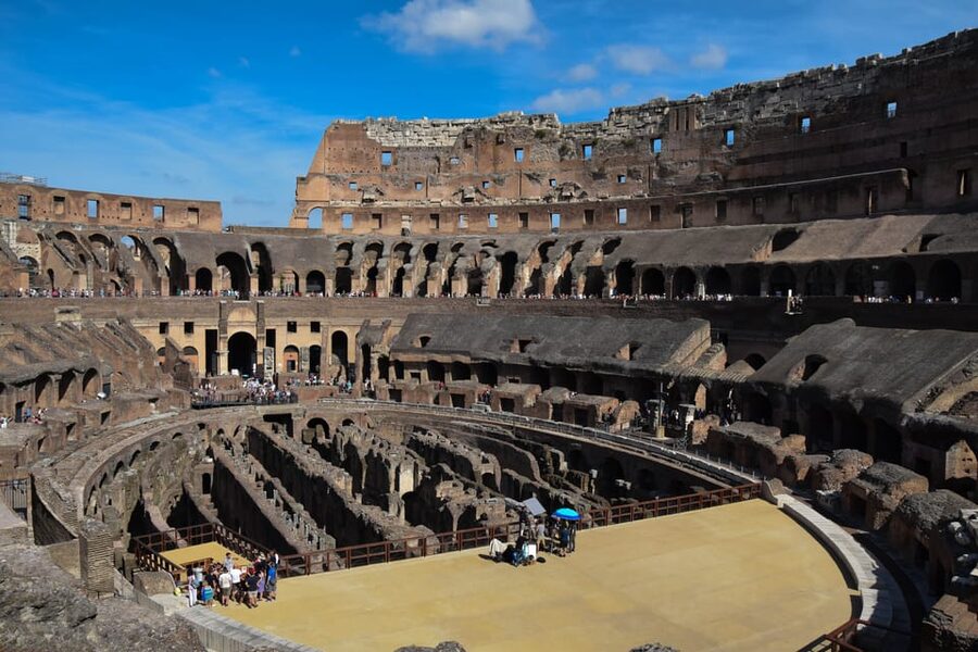 Rome: Colosseum Experience with Audio Guide and Arena Option - Entering the Colosseum via restricted Arena Floor access