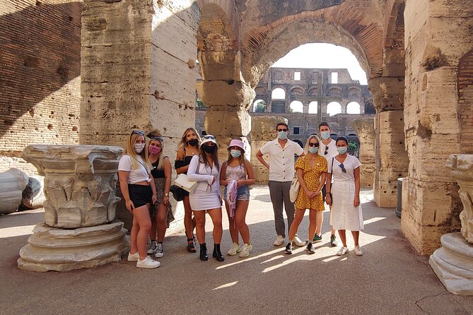 Rome: Colosseum Guided Tour with Roman Forum and Palatine Hill - Entering the Colosseum with a live guide and headsets
