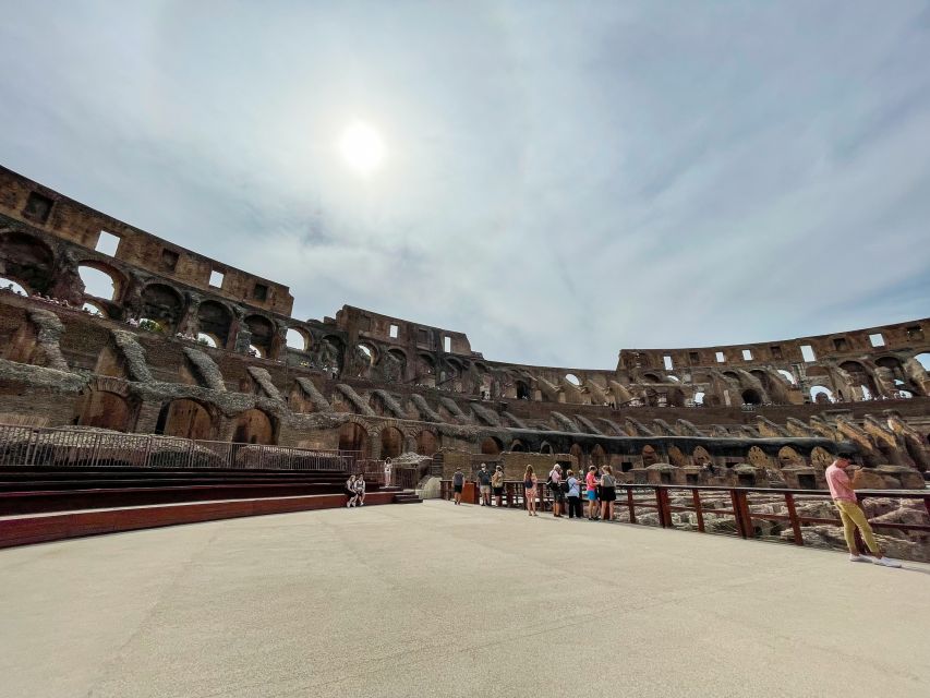 Rome: Colosseum Tour with Access to the Gladiator Arena - Guides, headsets, and keeping your footing in a packed site