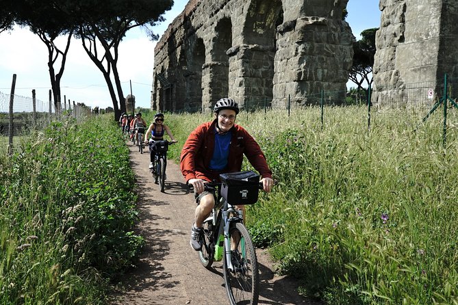 Rome EBike Tour: Appian Way, Catacombs & Roman Aqueducts - Parco degli Acquedotti: aqueduct arches on a bike path