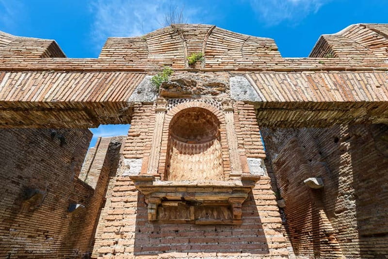 Rome: Ostia Antica Archaeological Park Ticket & Audio App - Procoio villas: the bath complex and stone theater masks