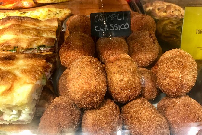Rome Street Food Tour with Local Guide - Il Portico di Ottavia and Theatre-of-Pompey area ruins: ruins you can actually notice