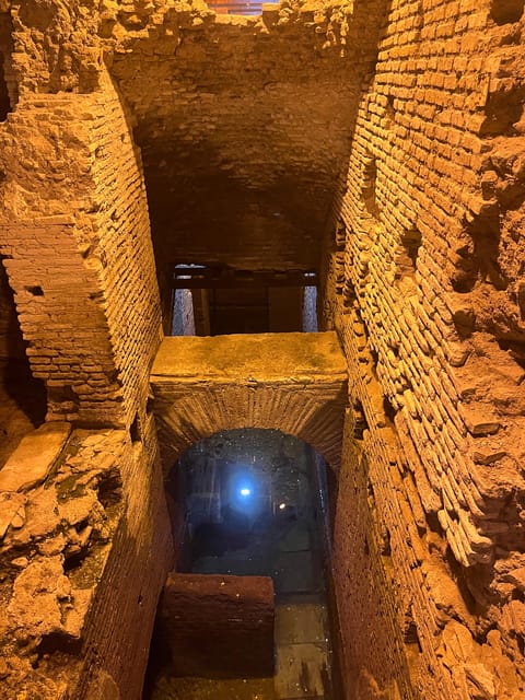 Rome: Trevi Fountain District Underground Tour and Ice Cream - Vicus Caprarius underground tour: cool air, real Roman engineering