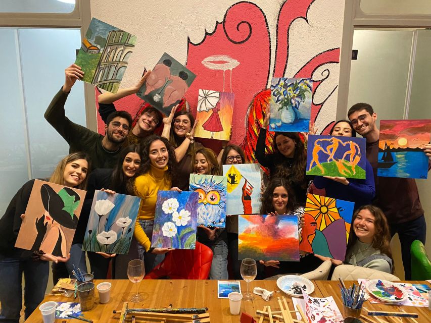Rome: Wine and Paint Experience in Piazza Navona - Studio Setup: Canvas, Art Supplies, Wine, and Roman Pizza